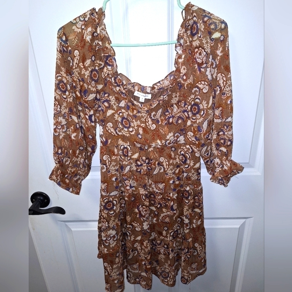 A Blu Pepper low-cut Romper in a size small. It's brown with a floral pattern